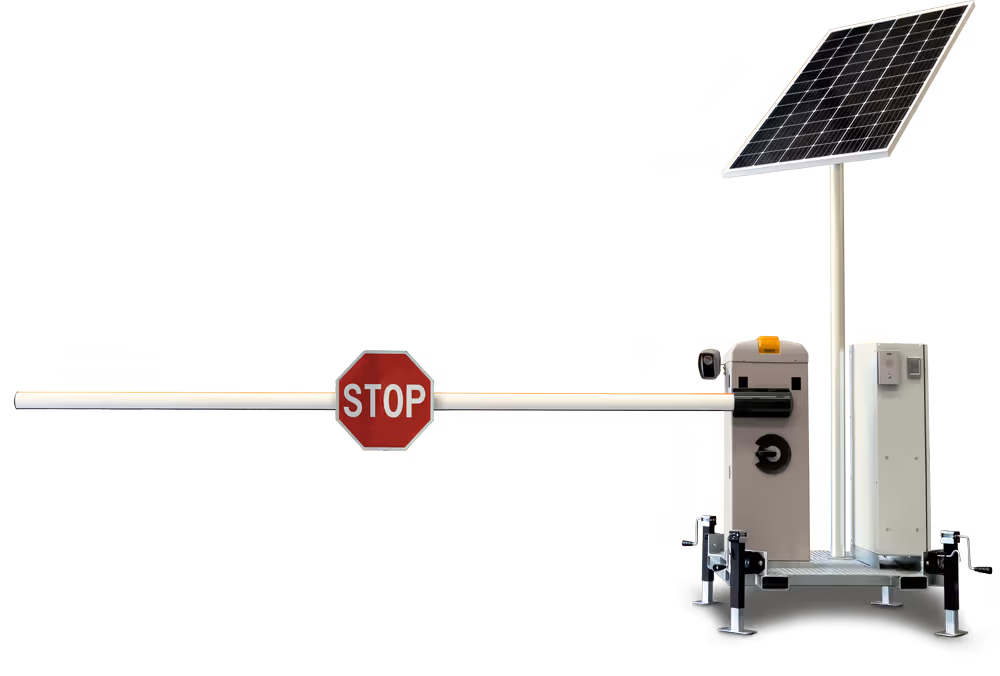 Solar-powered barrier gate with a stop sign, used for controlling vehicle access.